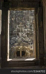 Statue carved at temple, Bayon Temple, Angkor Thom, Siem Reap, Cambodia