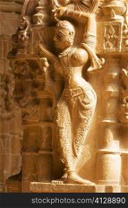 Statue carved on the wall of a temple, Jaisalmer, Rajasthan, India