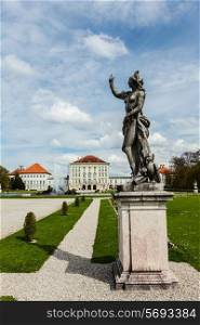 Statue Grand Parterre Baroque garden and the rear view of the Nymphenburg Palace. Munich, Bavaria, Germany
