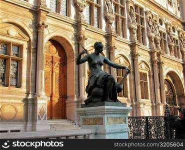 Statue in front of a building, Paris, France