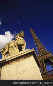 Statue in front of a tower, Eiffel Tower, Paris, France