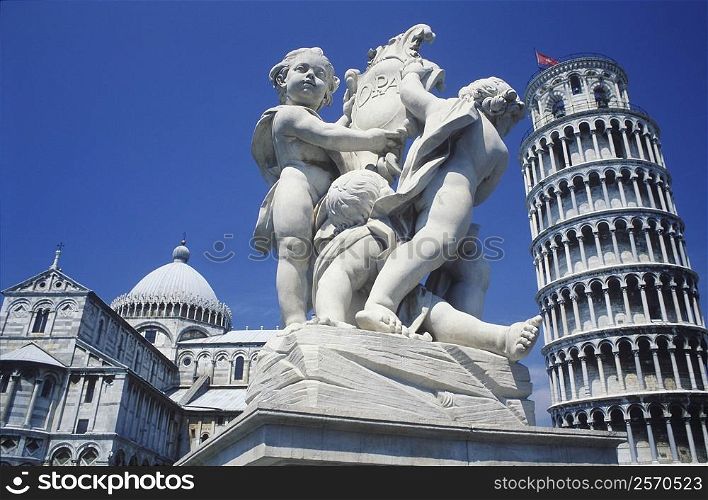 Statue in front of a tower, Leaning Tower of Pisa, Pisa, Italy