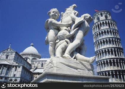 Statue in front of a tower, Leaning Tower of Pisa, Pisa, Italy