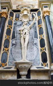 Statue in the shape of a skeleton . Statue in the shape of a skeleton indicating the ossuary of the Church Saint Etienne in Bar le Duc in the department of Meuse in France