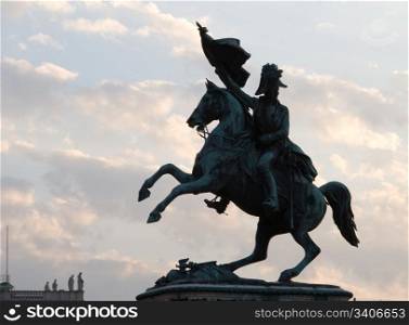 Statue of a horseman near Hofburg, Vienna - sunset.