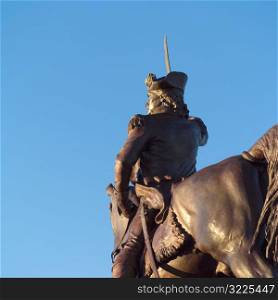 Statue of a man riding on a horse
