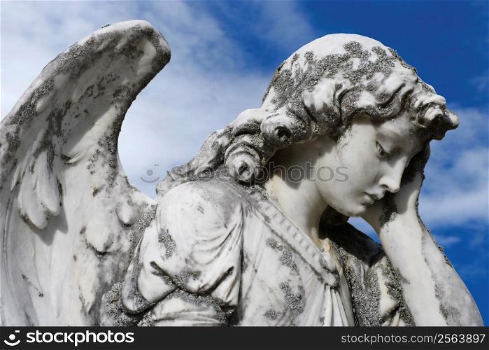 Statue of an sad angel. Sculpture was on top of a gravestone from the 1800&acute;s.