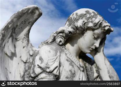 Statue of an sad angel. Sculpture was on top of a gravestone from the 1800&acute;s.