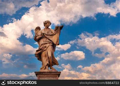 Statue of Angel on Saint Angel Bridge, Rome, Italy. Marble statue of Angel with the Sudarium at sunset, one of the ten angels on Saint Angel Bridge, symbols of Christ&rsquo;s Passion, Rome, Italy