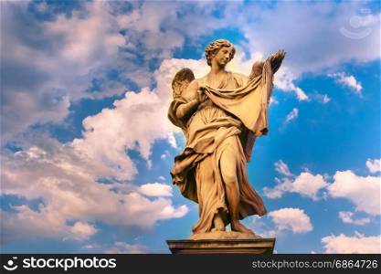 Statue of Angel on Saint Angel Bridge, Rome, Italy. Marble statue of Angel with the Sudarium at sunset, one of the ten angels on Saint Angel Bridge, symbols of Christ&rsquo;s Passion, Rome, Italy