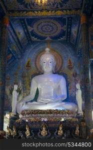 Statue of Buddha at temple, Rong Suea Ten Temple, Chiang Rai, Thailand