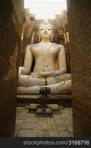 Statue of Buddha in a temple, Wat si chum, Sukhothai, Thailand