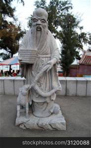 Statue of chinese buddha on the street in Chongwu, China