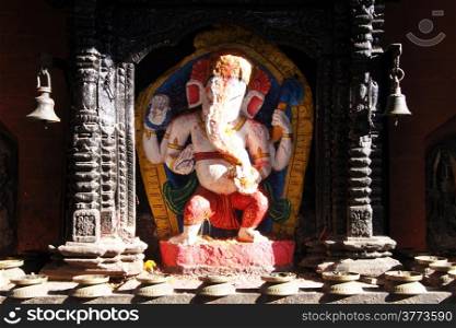 Statue of elephant headed hindu god Gnesha on the shrine