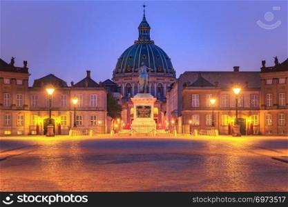 Statue of Frederick V at the centre of the Amalienborg Palace Square and Amalienborg Palace in Copenhagen, capital of Denmark.. Christiansborg palace in Copenhagen, Denmark