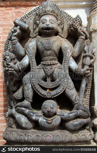 Statue of hindu god near entrance of Art museum in Bhaktapur, Nepal