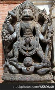 Statue of hindu god near entrance of Art museum in Bhaktapur, Nepal