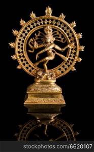 Statue of indian hindu god Shiva Nataraja - Lord of Dance on black background with reflection. Statue of Shiva Nataraja - Lord of Dance