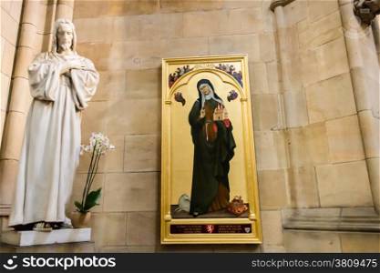 Statue of Jesus Christ and painting of Saint Agnes of Bohemia inside Saint Vitus Dome in Prague