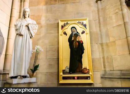 Statue of Jesus Christ and painting of Saint Agnes of Bohemia inside Saint Vitus Dome in Prague