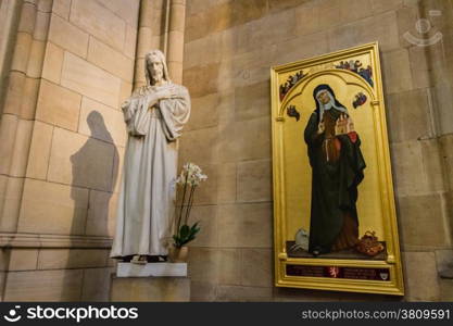 Statue of Jesus Christ and painting of Saint Agnes of Bohemia inside Saint Vitus Dome in Prague