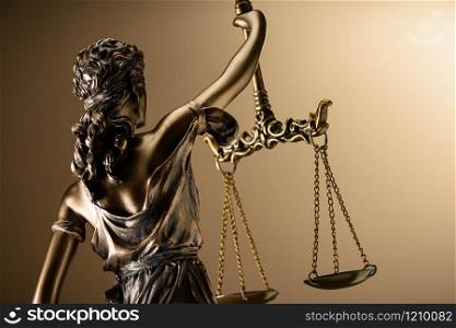 Statue of justice on yellow