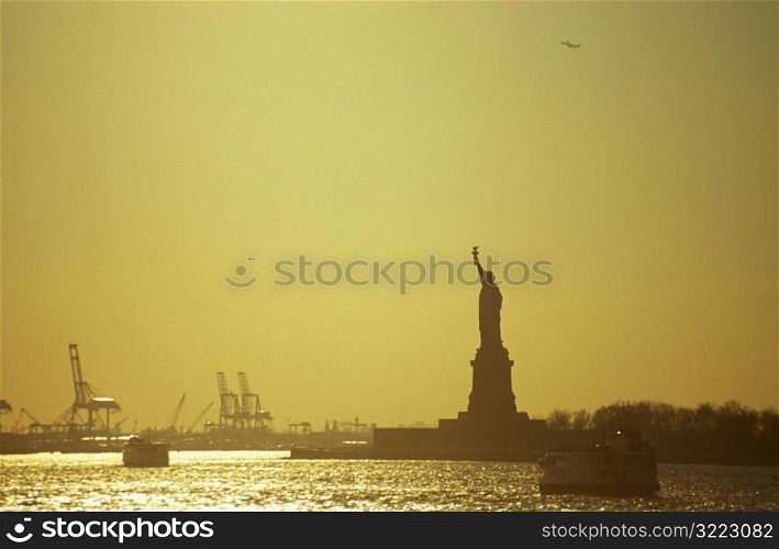 Statue Of Liberty Against A Golden Sky