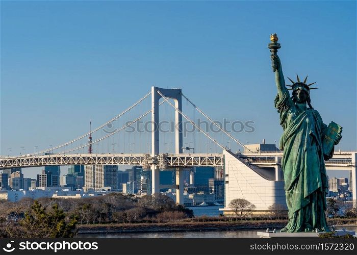 Statue of Liberty and Rainbow bridge, located at Odaiba Tokyo, Japan