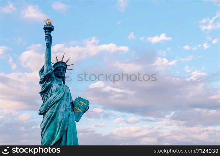 Statue of Liberty at Odaiba Tokyo - Japan aginst beautiful blue evening sky. Replica of original monument in New York. With copy space on one side