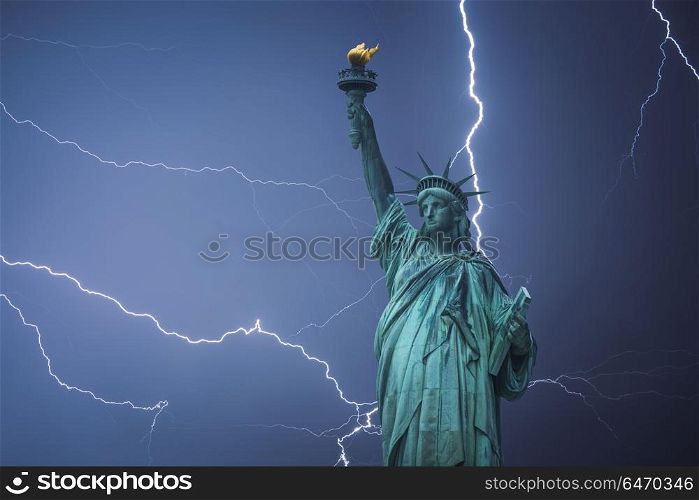 Statue of Liberty Neoclassical sculpture on Liberty Island southwest of Manhattan Island, USA. Powerful lightning strike.. Statue of Liberty