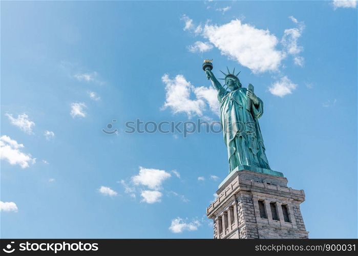 Statue of Liberty on sunny day, clear blue sky background. United States nation symbol, travel destination or America tourist attraction concept