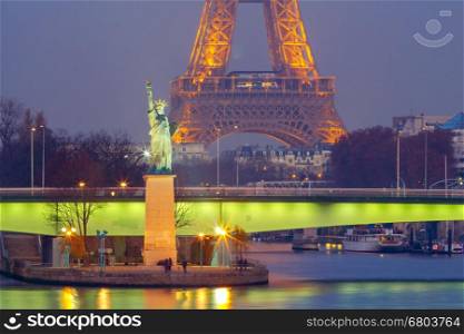 Statue of Liberty on the swan island in Paris at sunset. France.. Paris. The Statue of Liberty.