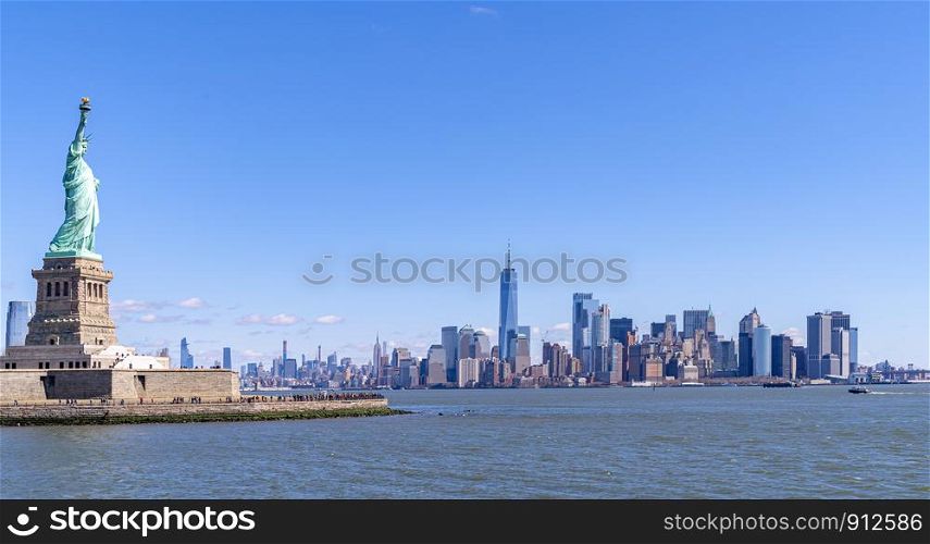 Statue of Liberty with Manhattan downtown Skylines building in background, New York City , NYC USA.