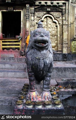 Statue of lion near door of temple Changu Narayan near Bhaktapur, Nepal