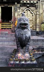 Statue of lion near door of temple Changu Narayan near Bhaktapur, Nepal