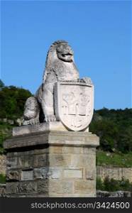 Statue of lion with shield in the city of Veliko Tarnovo in Bulgaria