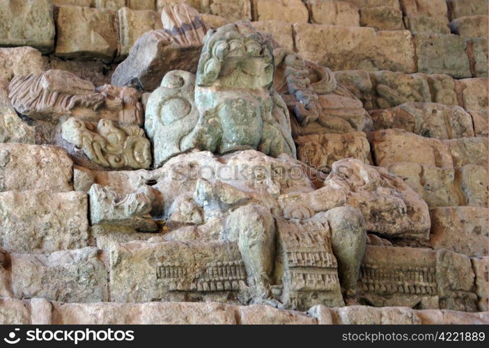 Statue of mayan god on the steps of pyramid in Copan, Honduras