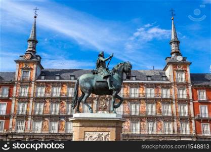Statue of Philip III at Mayor plaza in Madrid in a beautiful summer day, Spain