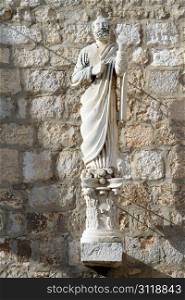 Statue of sain near church in Supetar, Brach island, Croatia