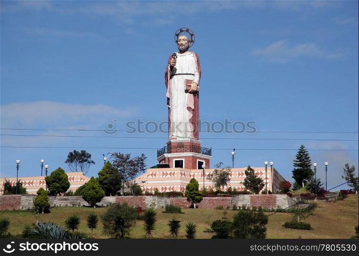Statue of Sain Peter with key on the hill in Alahusi in Ecuador
