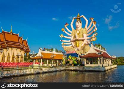 Statue of Shiva in Wat Plai Laem Temple, Samui, Thailand in a summer day