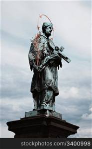 Statue of St. John of Nepomuk on the Charles bridge, Prague, Czech republic