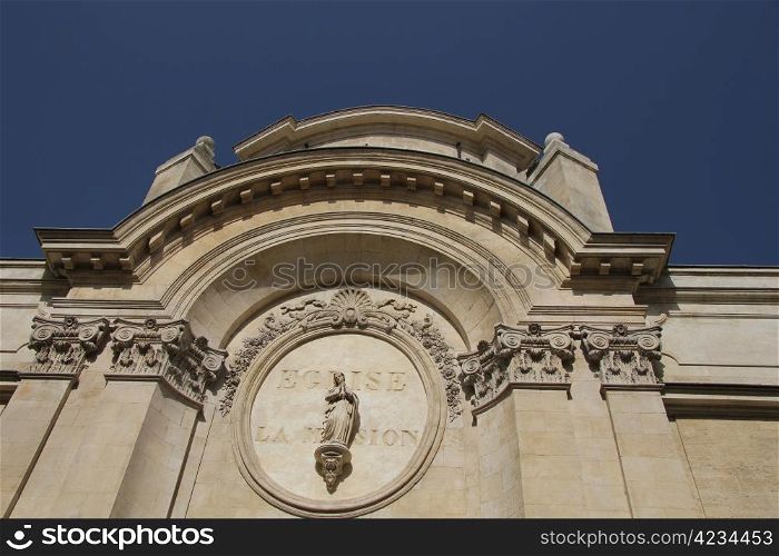 Statue of the Virgin Mary on the facade of the eglise la mission in Avignon