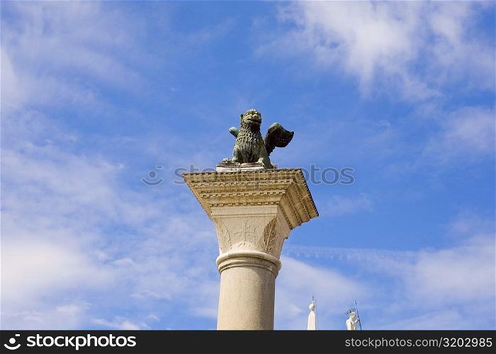 Statue of winged lion on a column, St. Mark&acute;s Square, Venice, Italy