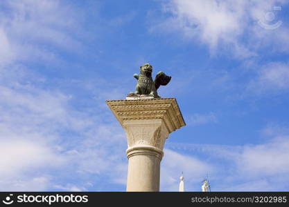 Statue of winged lion on a column, St. Mark&acute;s Square, Venice, Italy