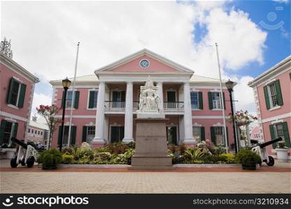 Statue on a pedestal in front of a government building, Parliament, Nassau, Bahamas