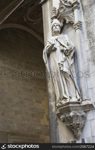Statue on side of church in Siena.