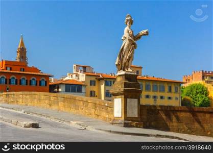 Statue on the bridge of Santa Trinita over the river Arno in Florence, Tuscany, Italy