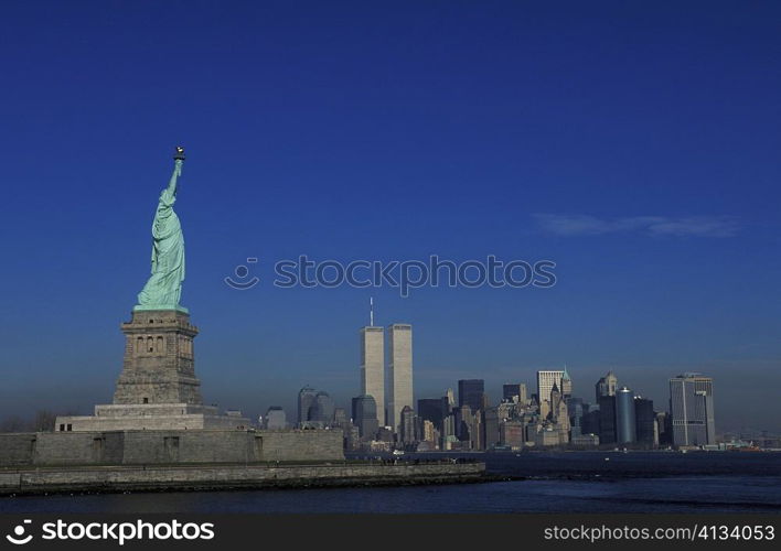 Statue with skyscrapers in the background, Statue Of Liberty, New York City, New York State, USA