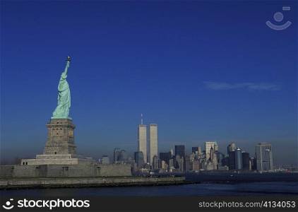 Statue with skyscrapers in the background, Statue Of Liberty, New York City, New York State, USA